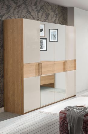 Wiemann Drehtürenschrank »Kiruna« mit Champagnerglas und Spiegel