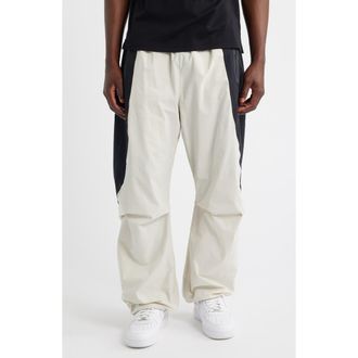 Nike Tech Dri-FIT Woven Oversize Stretch Nylon Pants in Light Bone/Black at Nordstrom, Size Xx-Large