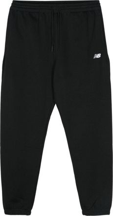 New Balance embroidered-logo jersey track pants - men - Recycled Polyester/Cotton - S - Black