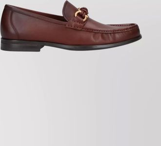 Ferragamo round toe loafers featuring metal hardware