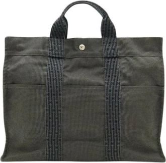 Herm&egrave;s Pre-owned Canvas Aline Tote MM Bag - Dames - Vintage Shopper - Grijs - ONE Size - Vintage