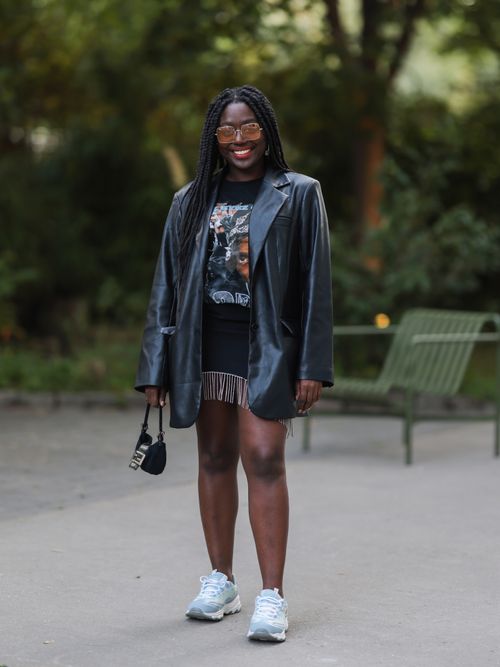 BERLIN, GERMANY - SEPTEMBER 07: Lois Opoku wearing a black leather jacket, a black dress and sneakers on September 07, 2021 in Berlin, Germany. (Photo by Jeremy Moeller/Getty Images)