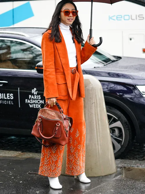 orange suit and white shirt