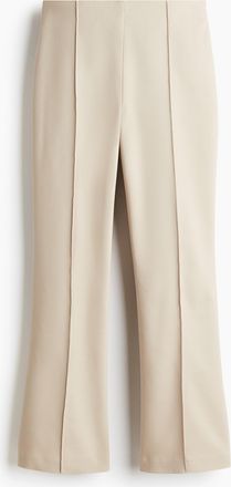H&M Ausgestellte Hose mit Bügelfalten - Beige