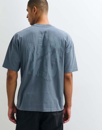 AllSaints Orlando T-shirt in cotone a maniche corte con logo grafico e stampa sul retro azzurro chiaro-Blu
