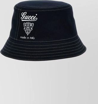 Gucci bucket hat featuring coat of arms design