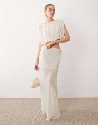 SNDYS Gonna lunga in chiffon trasparente bianco sporco con laccetti laterali a contrasto in coordinato