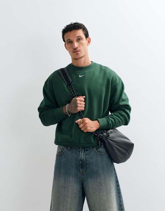Nike Solo - Felpa oversize in pile verde scuro con logo Swoosh centrale