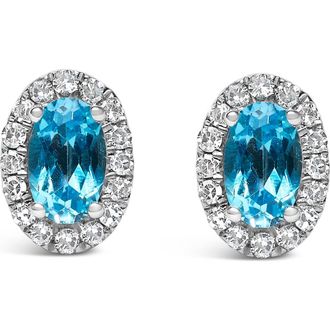 House of Brilliance 10K White Gold 5x3 MM Oval Cut Birthstone and Diamond Halo Stud Earrings in Blue Topaz at Nordstrom