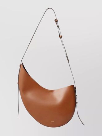 SOEUR curved leather shoulder bag with gold hardware