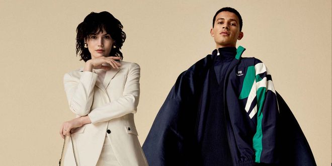 Frau in weißem Hosenanzug und Mann in blauem Trainingsanzug.