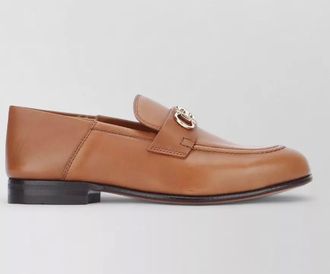 Ferragamo loafers ottone featuring signature gold tone hardware