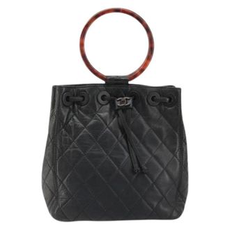 Chanel Pre-owned Bucket Bags, female, Black, Size: ONE SIZE Pre-owned Vintage resin handle drawstring bucket bag