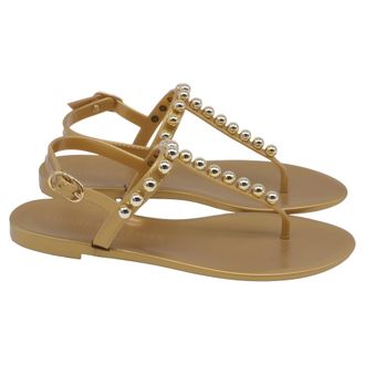 Stuart Weitzman Goldie Jelly Sandals in Gold PVC