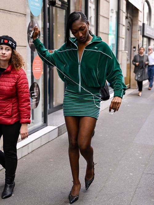 Isan Elba is seen wearing a green Lacoste jacket, Lacoste green skirt and black heels outside the Lacoste show during Womenswear Spring/Summer 2025 as part of Paris Fashion Week on October 01, 2024 in Paris, France.