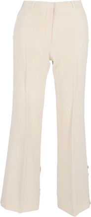 The Row Flared Trousers in Cream Cotton