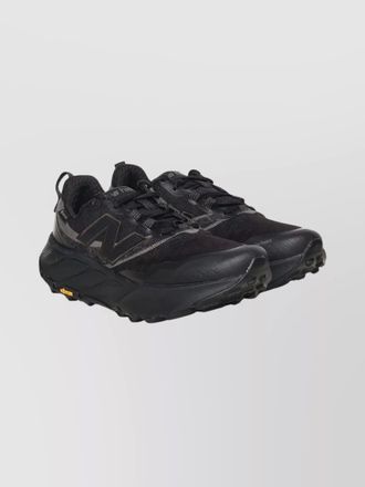 New Balance sneakers featuring mesh panels and pull tab