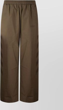 Off-white straight trousers featuring elastic waistband