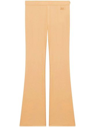 Courrèges embroidered logo flared-leg trousers - Neutrals