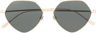 Gucci logo-engraved round-frame sunglasses - women - Metal - 55 - Gold