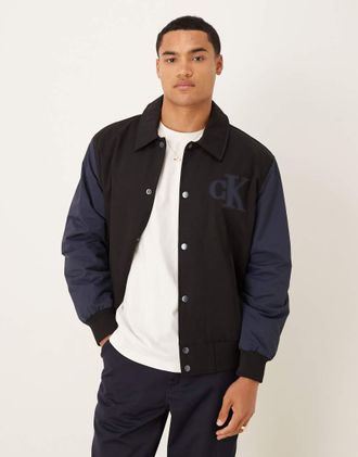 Calvin Klein Jeans Bomber stile college in cotone nero e blu