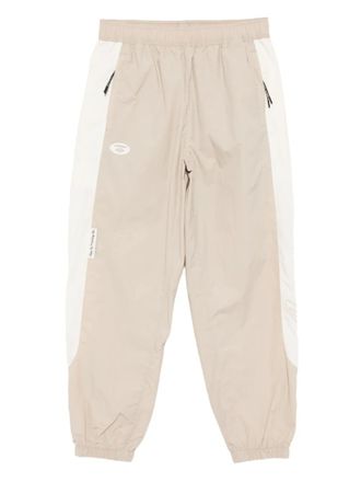 Aape By A Bathing Ape logo-embroidered trousers - men - Nylon - S - Neutrals