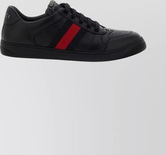 Gucci low-top sneakers with embossed pattern and rubber sole