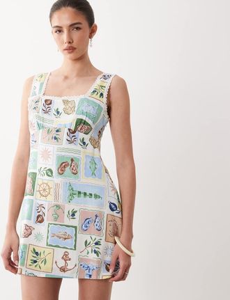 Nobody's Child Ciara - Vestito corto senza maniche in misto lino con scollo quadrato e stampa cartolina-Bianco