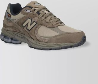 New Balance low top sneakers with mesh panels and rubber outsole