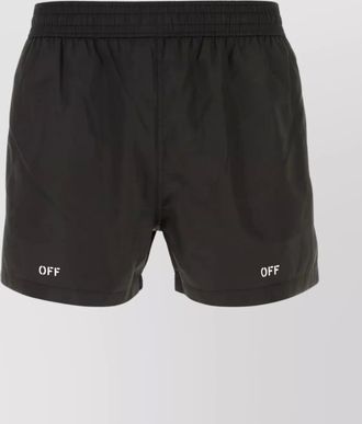 Off-white polyester swim shorts with elastic waist and pockets