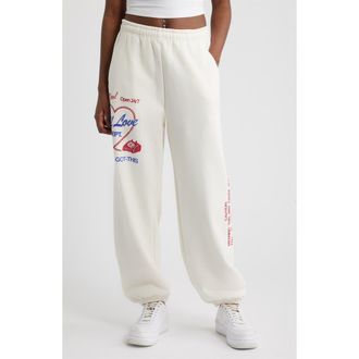The Mayfair Group Self Love Club Oversize Fleece Graphic Sweatpants in Cream at Nordstrom, Size Xx-Large