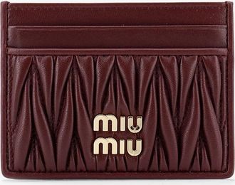 Miu Miu Portacarte in pelle matelass&eacute; con logo lettering in metallo - MIU MIU - gender_Woman