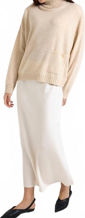 Brodie Pippin Roll Neck Jumper In Cygnet