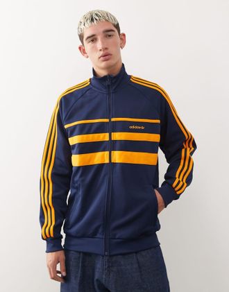 adidas Originals First - Giacca sportiva blu navy e arancione