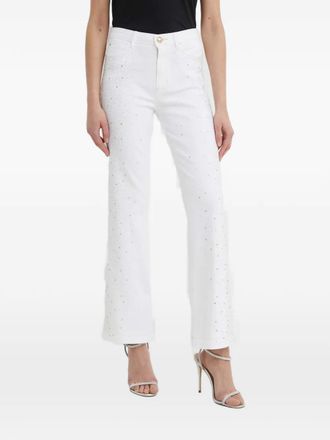 Guess Co rhinestone-embellished flared jeans - White