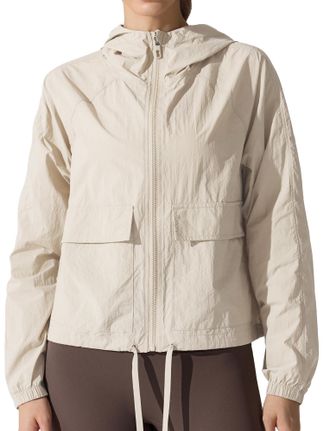 Feoya Womens Lightweight Waterproof Outdoor Jacket UPF 50+ Hooded Breathable Running Windbreaker with Pocket for Cycling Hiking Beige M