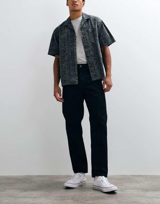 Carhartt Work in Progress jeans Newel relaxed tapered fit lavaggio nero