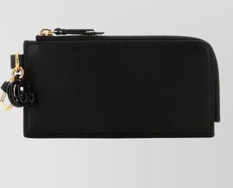 Gucci leather card holder featuring gold-tone hardware