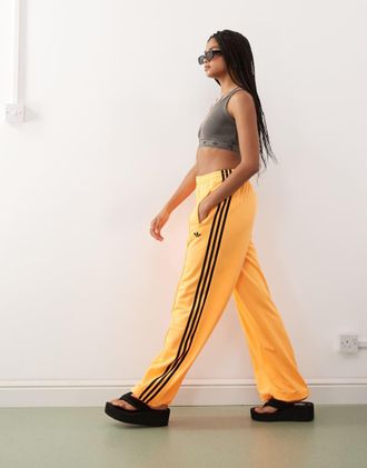 adidas Originals Firebird - Pantaloni della tuta ampi arancioni e neri-Arancione