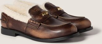 Miu Miu Bleached leather and shearling penny loafers