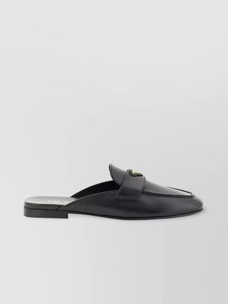 Prada triangle detail leather round toe mules