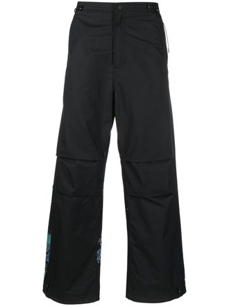 maharishi graphic-print trousers - Black