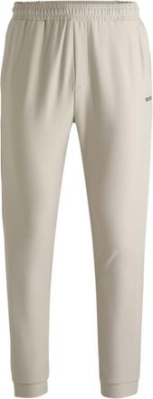 BOSS Tracksuit bottoms in stretch fabric with decorative reflective logo