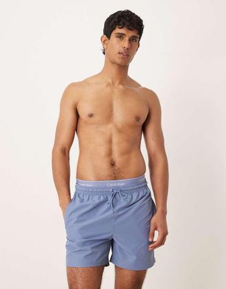 Calvin Klein Pantaloncini da bagno blu con coulisse e fascia in vita con logo