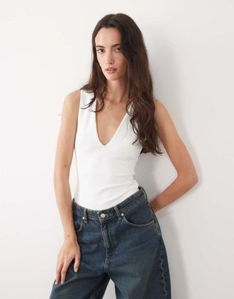 Good American Body modellante senza maniche con scollo a V profondo in cotone bianco-Nero