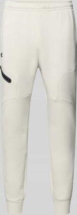 Under Armour Regular Fit Sweatpants mit Logo-Print Modell Unstoppable in Offwhite, Gr&ouml;&szlig;e XXL