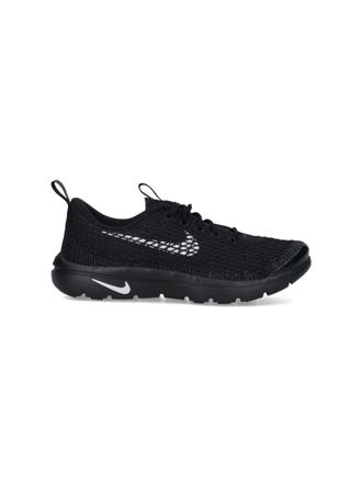Comme Des Gar&ccedil;ons Textured Black Sneakers With Low-Profile Design And Distinctive Branding
