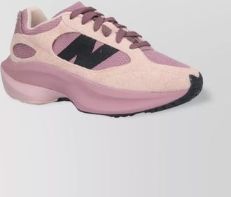 New Balance low top sneakers with rubber outsole and textured panels
