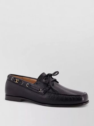 Valentino Garavani loafers featuring metal eyelets round toe