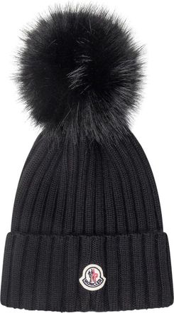 Moncler Zwarte geribbelde wollen muts met bont pom-pom - Dames - Hoeden - Zwart - L - Wol - Accessoires